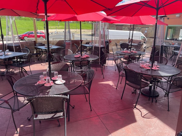 table, furniture, property, outdoor table, chair, umbrella
