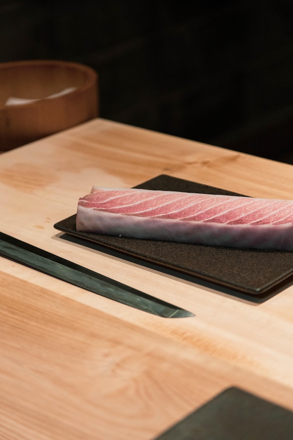 food, cutting board, fish slice, sashimi, meat, kitchen utensil