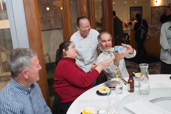 shirt, tableware, smile, drinkware, furniture, coat