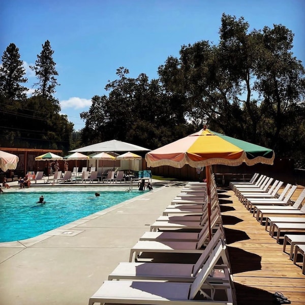 swimming pool, outdoor furniture, umbrella, leisure, resort, furniture